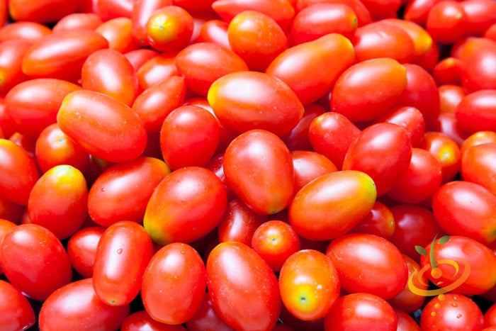 Red Pear Tomato Seeds | Close-up of vibrant red pear tomatoes with smooth skin and small oval shapes