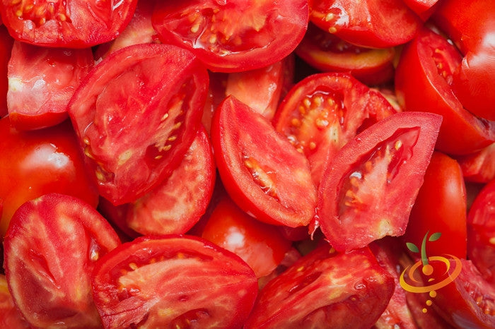 Close-up of bright red Bonny Best Tomato slices showing their small seed cores and firm texture